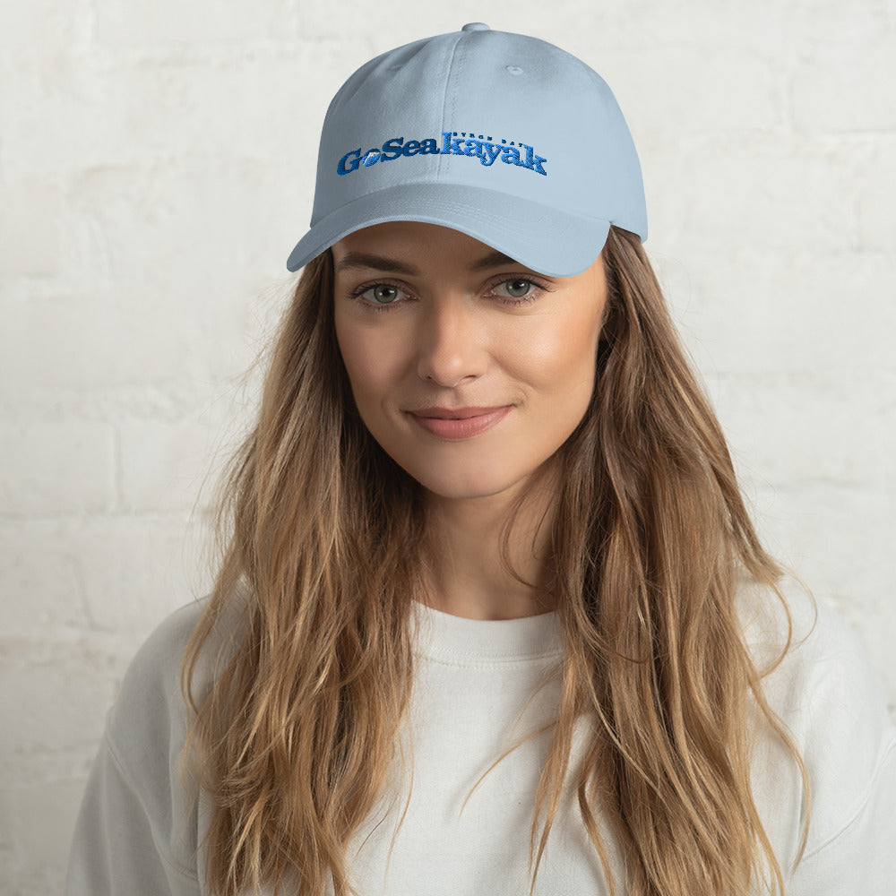  Unisex Cap - Light Blue - Front view on woman's head - Go Sea Kayak logo on front  - Genuine Byron Bay Merchandise | Produced by Go Sea Kayak Byron Bay