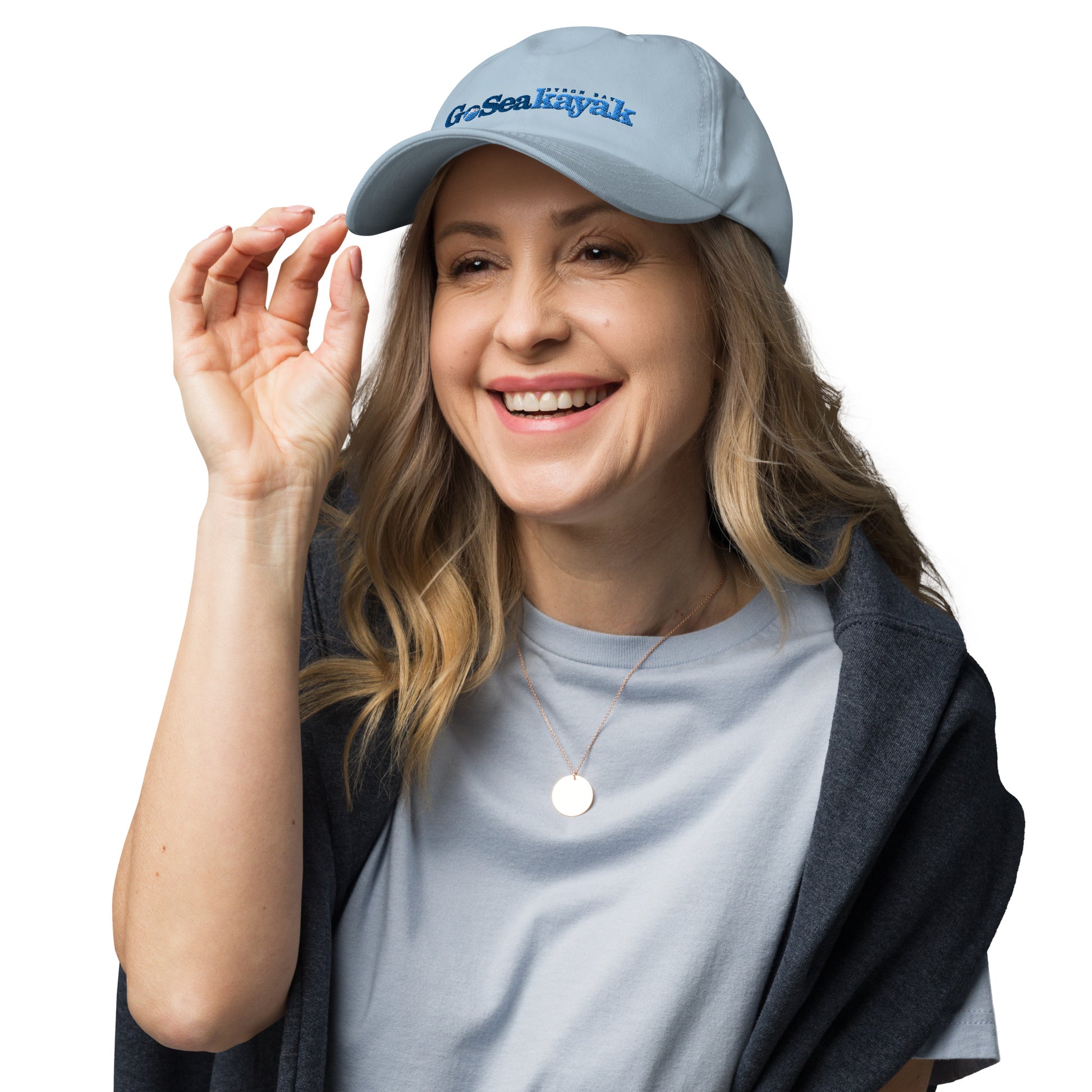  Unisex Cap - Light Blue - Front view on woman's head with hand touching brim -Go Sea Kayak logo on front  - Genuine Byron Bay Merchandise | Produced by Go Sea Kayak Byron Bay