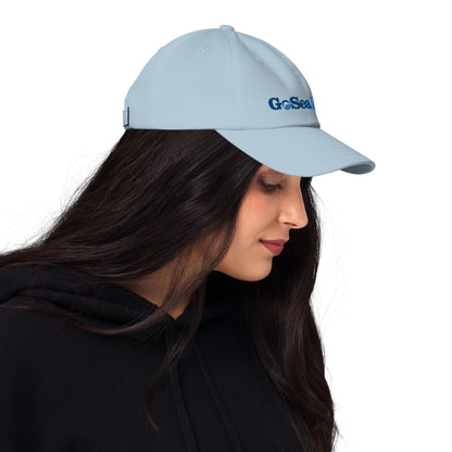  Unisex Cap - Light Blue - Woman wearing cap - profile view - Go Sea Kayak logo on front  - Genuine Byron Bay Merchandise | Produced by Go Sea Kayak Byron Bay