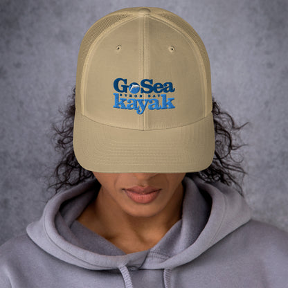  Trucker Cap - Khaki - Front view - being warn by woman with her head down - Go Sea Kayak Byron Bay logo on front - Genuine Byron Bay Merchandise | Produced by Go Sea Kayak Byron Bay 