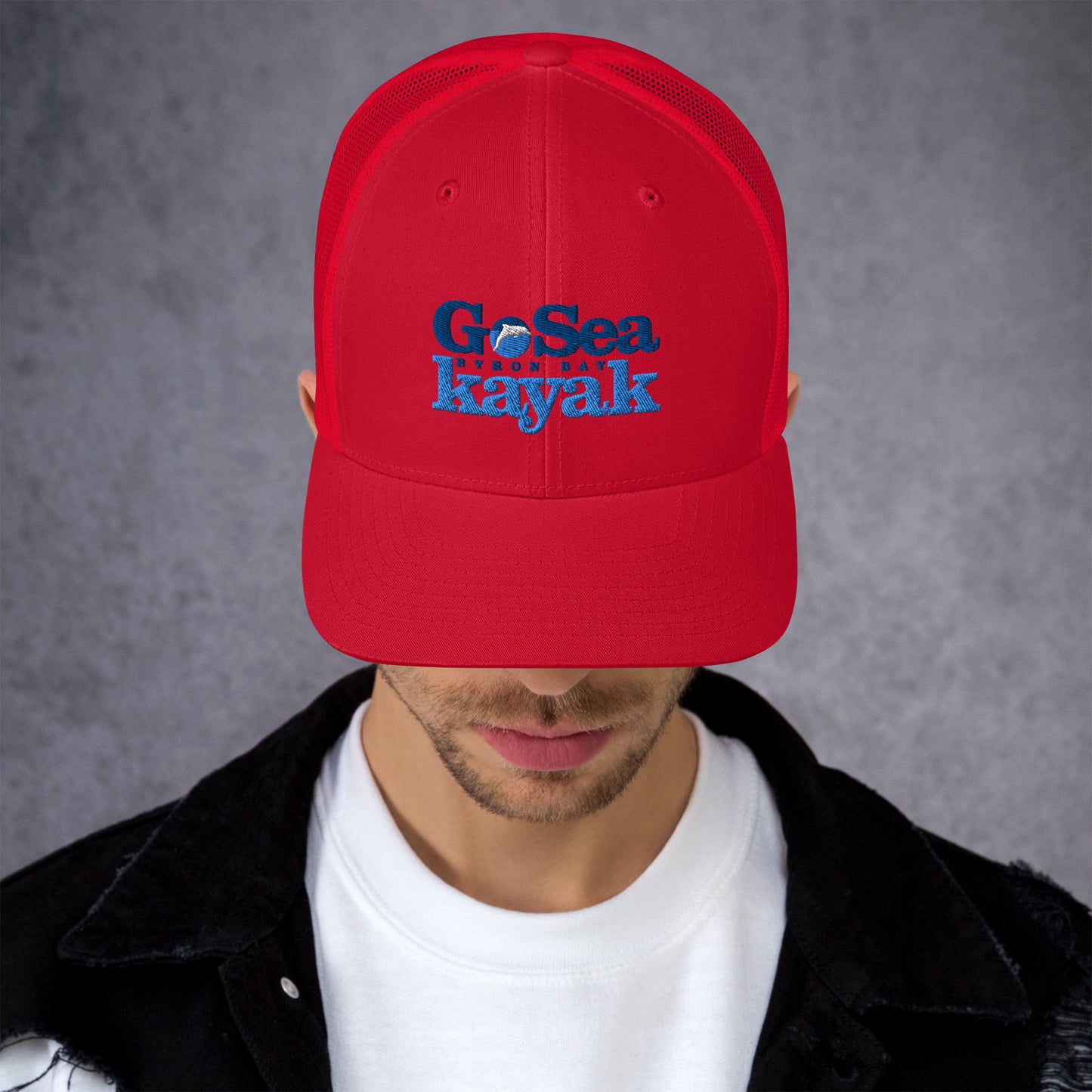  Trucker Cap - Red - Front view - being warn by man with his head down - Go Sea Kayak Byron Bay logo on front - Genuine Byron Bay Merchandise | Produced by Go Sea Kayak Byron Bay 