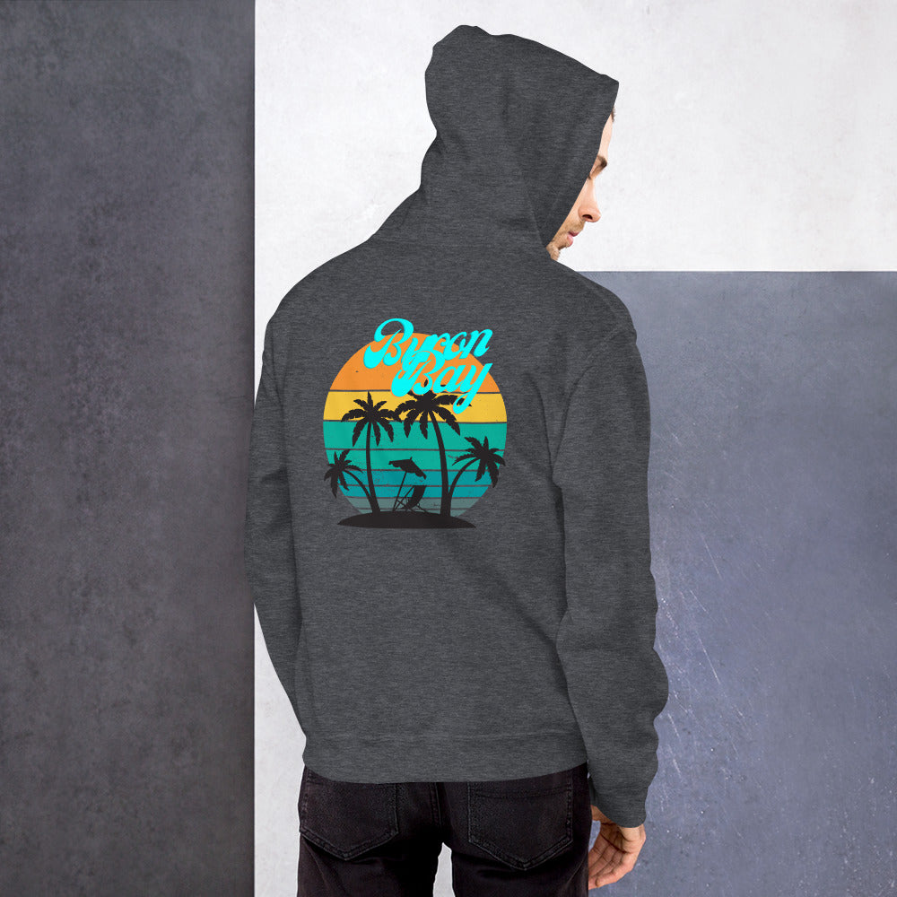  Unisex Hoodie - Dark Heather/Grey - Back view being warn by man with his arms by his side, looking back over his shoulder - Byron Bay design on back, plain front with pouch pocket - Genuine Byron Bay Merchandise | Produced by Go Sea Kayak Byron Bay 
