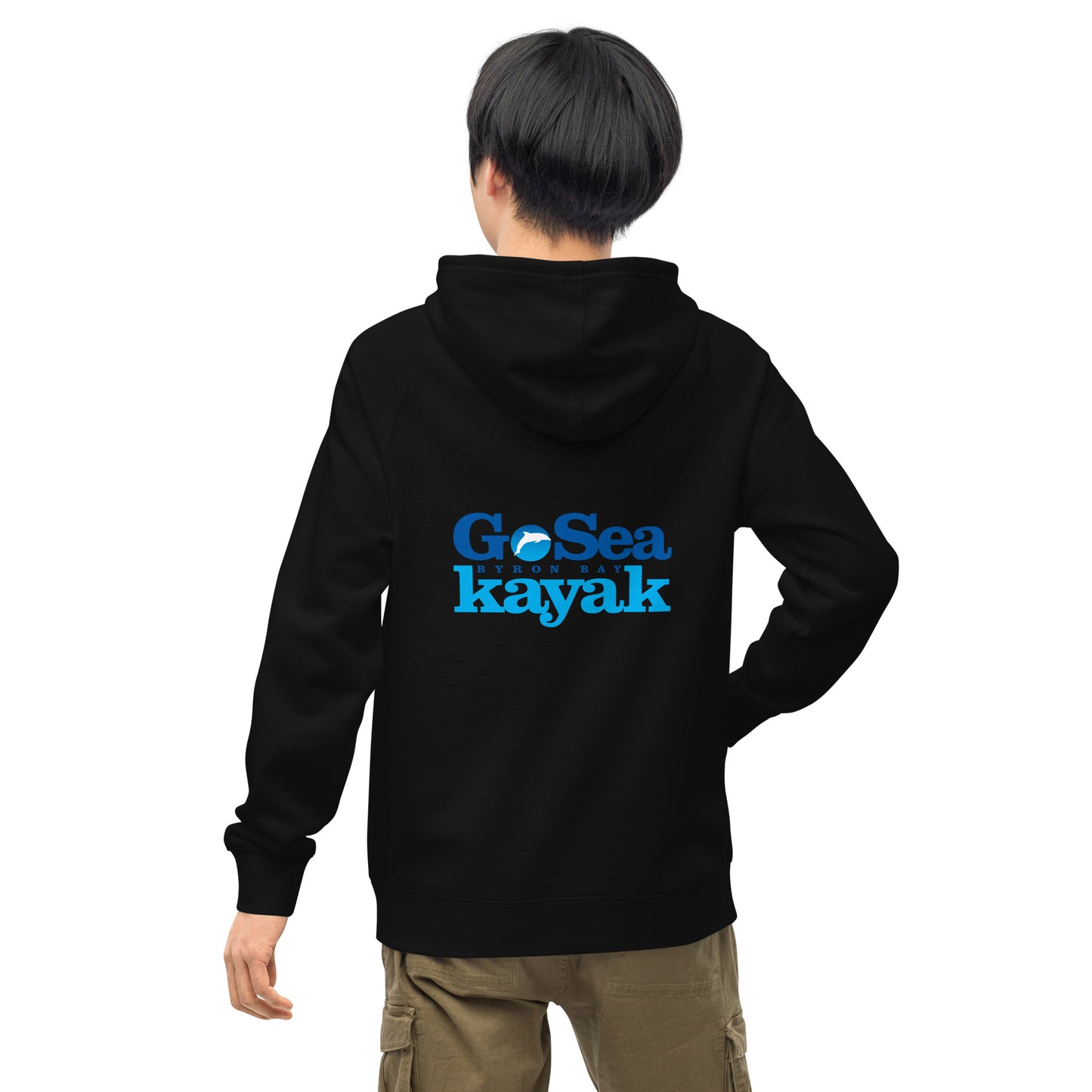  Unisex Hoodie - Black - Back view being warn by man with one arm by side and one hand in pocket - Go Sea Kayak Byron Bay logo on back and front, Kangaroo pocket on front - Genuine Byron Bay Merchandise | Produced by Go Sea Kayak Byron Bay 