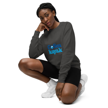  Unisex Sweatshirt - Coal - Front view, being warn by woman crouching down with one knee up - Go Sea Kayak Byron Bay logo on front - Genuine Byron Bay Merchandise | Produced by Go Sea Kayak Byron Bay 