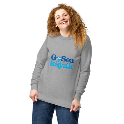  Unisex Sweatshirt - Grey Marle - Front view, being warn by woman holding the bottom of the jumper - Go Sea Kayak Byron Bay logo on front - Genuine Byron Bay Merchandise | Produced by Go Sea Kayak Byron Bay 