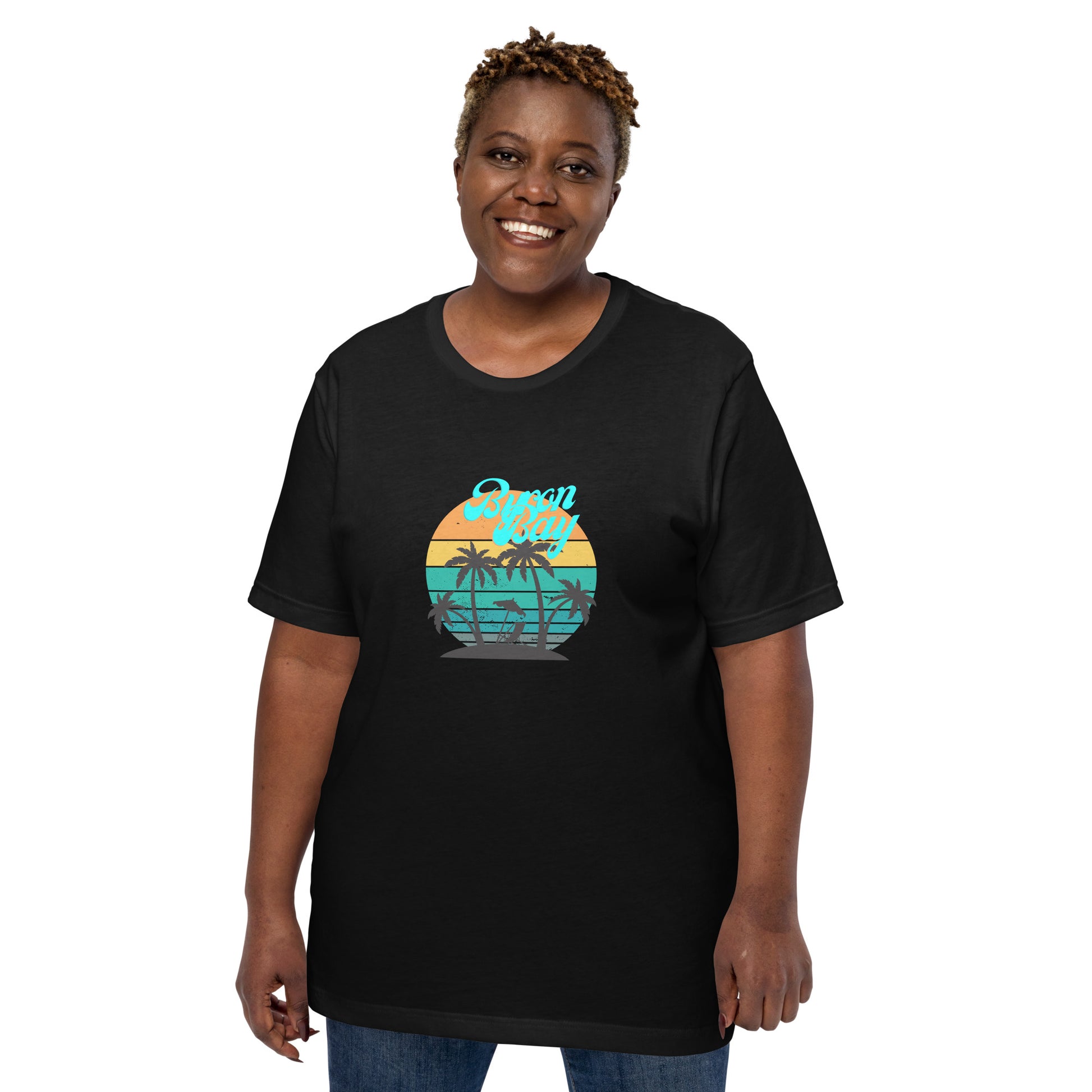  Unisex T-Shirt - Black - Front view, on woman standing with arms by side - Byron Bay design on front - Genuine Byron Bay Merchandise | Produced by Go Sea Kayak Byron Bay 