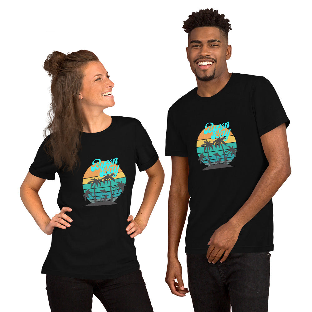  Unisex T-Shirt - Black - Front view, on woman and man standing next to eachother - Byron Bay design on front - Genuine Byron Bay Merchandise | Produced by Go Sea Kayak Byron Bay 