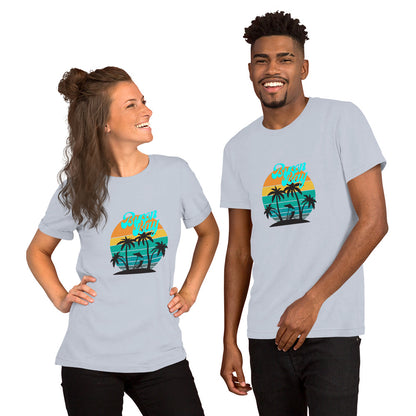  Unisex T-Shirt - Light blue - Front view, on woman and man standing next to eachother - Byron Bay design on front - Genuine Byron Bay Merchandise | Produced by Go Sea Kayak Byron Bay 