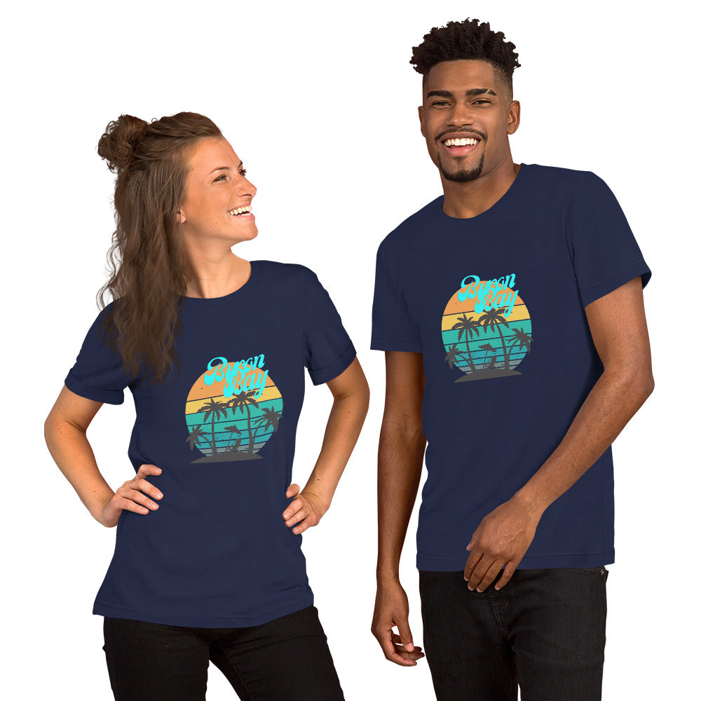  Unisex T-Shirt - Navy - Front view, on woman and man standing next to eachother - Byron Bay design on front - Genuine Byron Bay Merchandise | Produced by Go Sea Kayak Byron Bay 