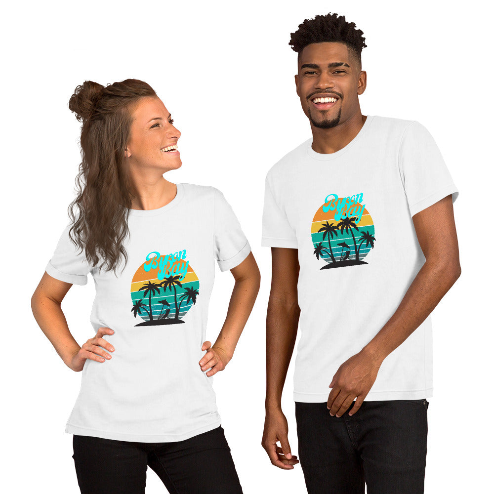  Unisex T-Shirt - White - Front view, on woman and man standing next to eachother - Byron Bay design on front - Genuine Byron Bay Merchandise | Produced by Go Sea Kayak Byron Bay 