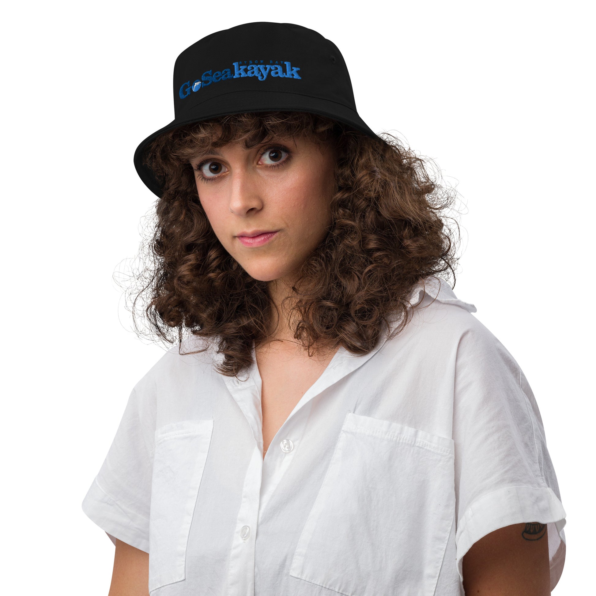  Unisex Bucket Hat - Black - Front view on woman's head - Go Sea Kayak Byron Bay logo on front  - Genuine Byron Bay Merchandise | Produced by Go Sea Kayak Byron Bay