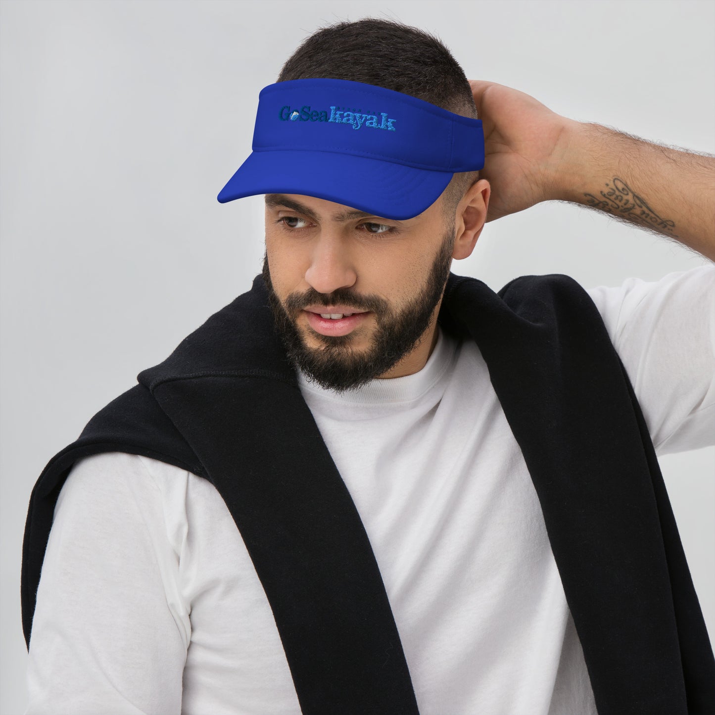  Visor - Royal Blue - Front view, on man standing with hand on the back of his head - Go Sea Kayak Byron bay logo on front - Genuine Byron Bay Merchandise | Produced by Go Sea Kayak Byron Bay 