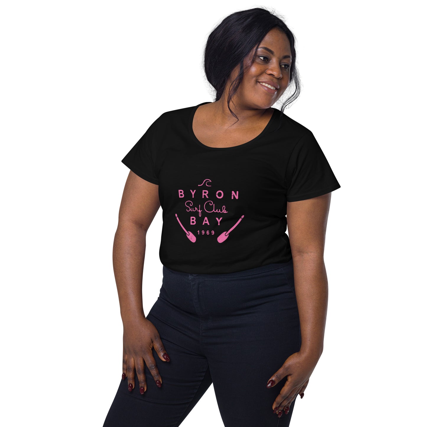  Women’s Round Neck Tee - Black - Front view, on woman standing with arms by side - pink Byron Bay Surf Club logo on front - Genuine Byron Bay Merchandise | Produced by Go Sea Kayak Byron Bay 