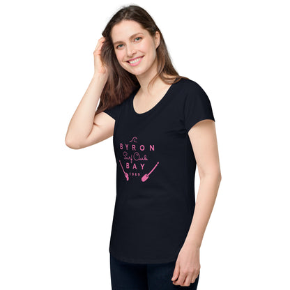  Women’s Round Neck Tee - Navy - Side view, on woman standing with one hand touching hair - pink Byron Bay Surf Club logo on front - Genuine Byron Bay Merchandise | Produced by Go Sea Kayak Byron Bay 