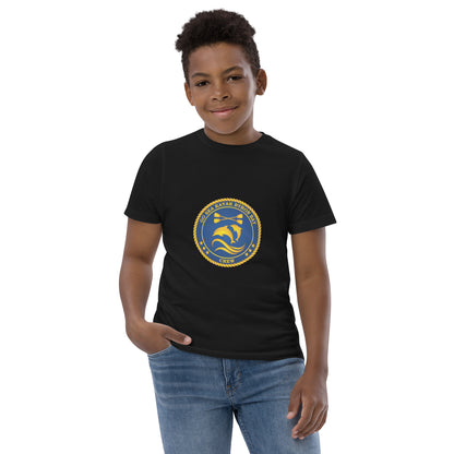  Kids T-Shirt - Black  - Front view, being warn on boy standing with a hand in his pocket - Go Sea Kayak Byron Bay Crew (issue 2018-2019) logo on front - Genuine Byron Bay Merchandise | Produced by Go Sea Kayak Byron Bay 