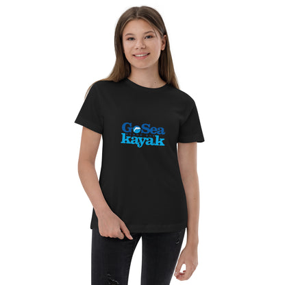  Kids T-Shirt - Black  - Front view, being warn on a girl holding the bottom of the tee with one hand - Go Sea Kayak Byron Bay logo on front - Genuine Byron Bay Merchandise | Produced by Go Sea Kayak Byron Bay 