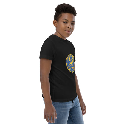  Kids T-Shirt - Black  - side view, being warn on boy standing with his arms by his side - Go Sea Kayak Byron Bay Crew (issue 2018-2019) logo on front - Genuine Byron Bay Merchandise | Produced by Go Sea Kayak Byron Bay 