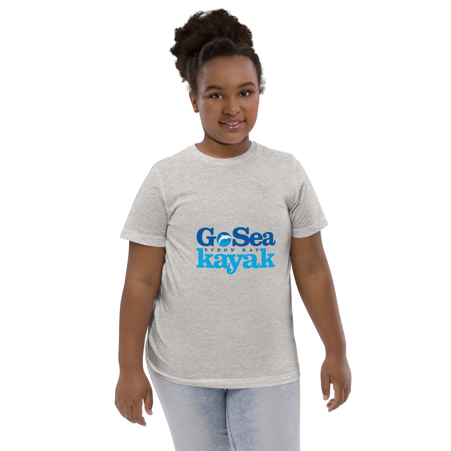  Kids T-Shirt - Natural / Heather colour - Front view, being warn on a girl standing with her arms by her side - Go Sea Kayak Byron Bay logo on front - Genuine Byron Bay Merchandise | Produced by Go Sea Kayak Byron Bay 